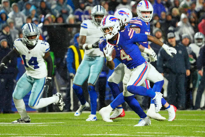Dec 17, 2023; Orchard Park, New York, USA; Buffalo Bills running back James Cook (4) runs the ball in for a touch down in the second half against the Dallas Cowboys at Highmark Stadium.
